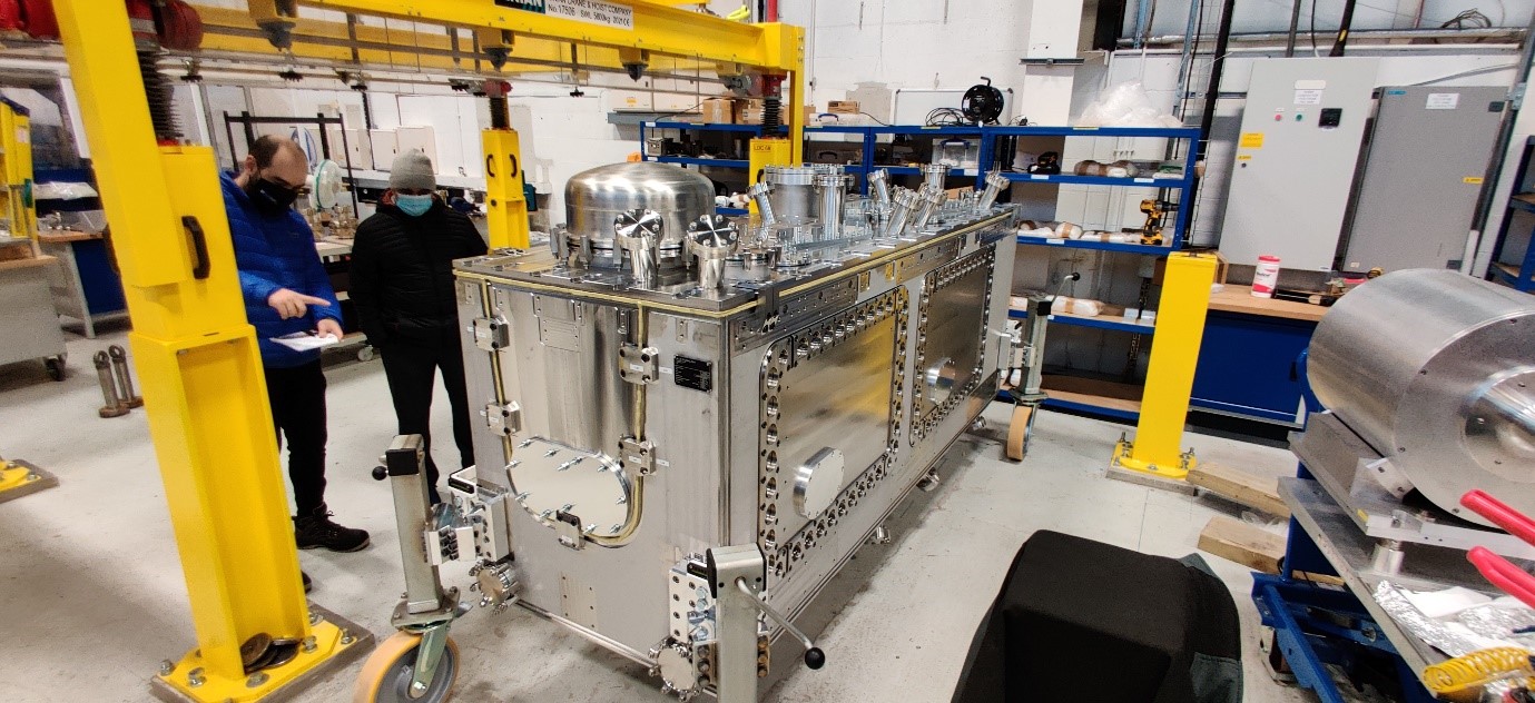 Fig. 3: Outer Vacuum Chamber for the Cryomodule adjacent to the bespoke Cavity String Lifting Device